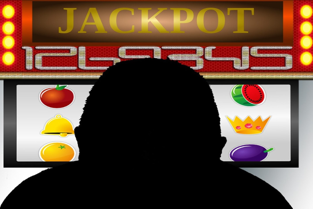 Ein Mann spielt an einem Online-Slot-Automaten mit einer "Jackpot"-Anzeige, umgeben von fruchtig-themen Elementen.
