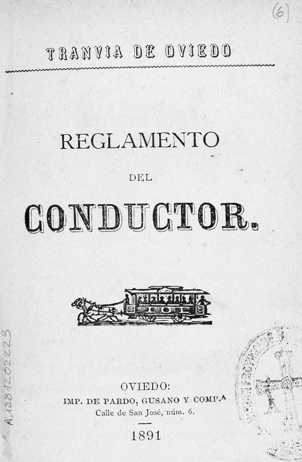Altes Buch mit dem Titel 'Reglamento de Conductor' und einer Zugillustration auf dem Cover und einem Stempel auf der rechten Seite.