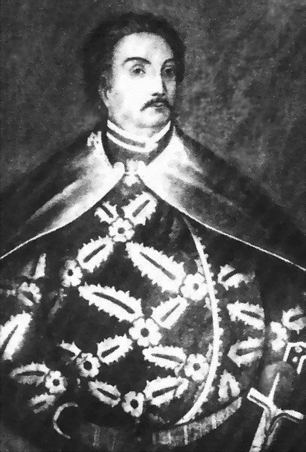 Schwarzes und weißes Foto von Papst Johannes Paul II. in Priesterrobe, der eine schwarze Robe mit weißem Kragen und Manschetten trägt und die Hände verschränkt.