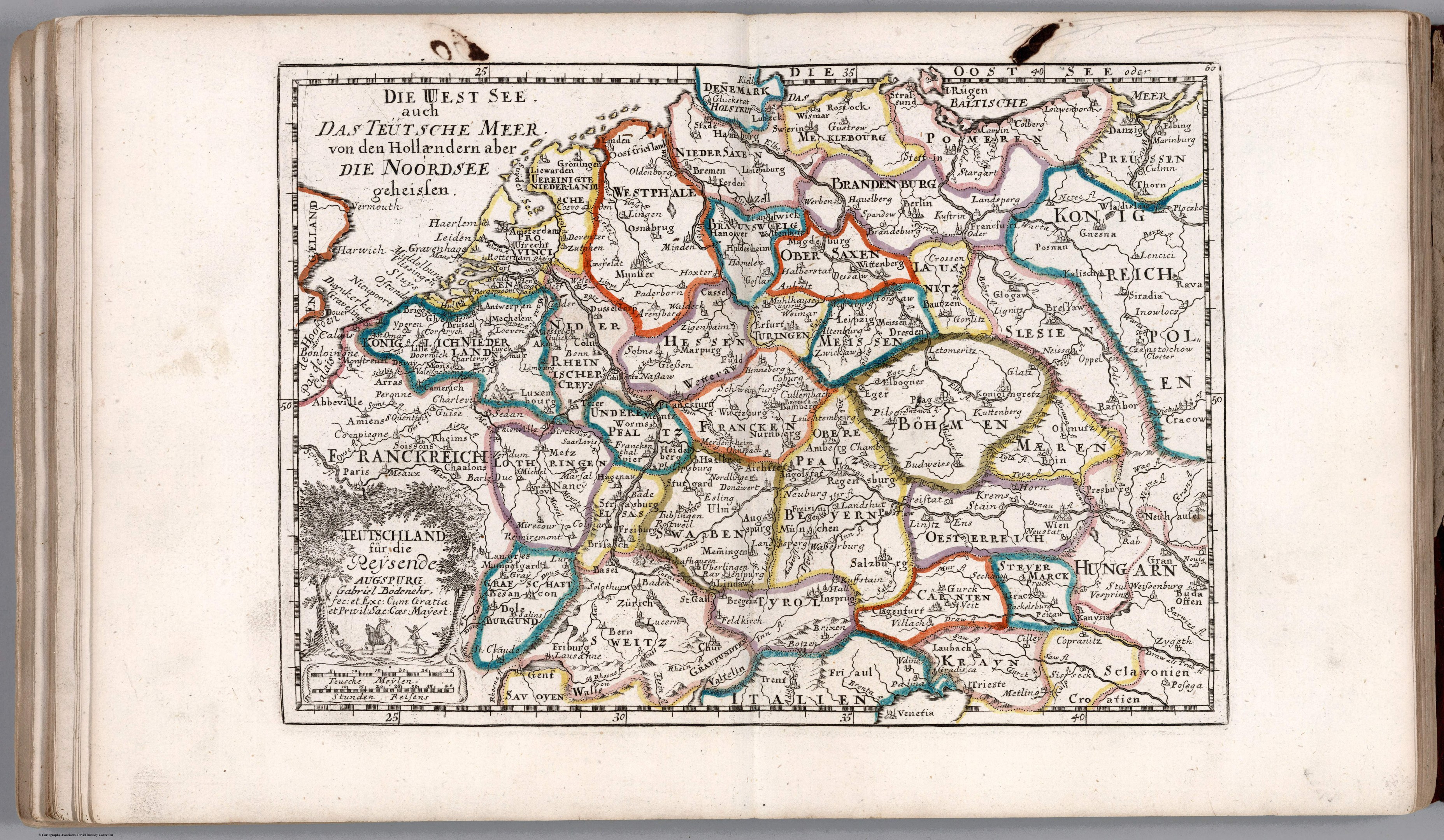 Offenes Buch mit einer detaillierten Deutschlandkarte mit geografischen Merkmalen wie Flüssen, Bergen und Städten, begleitet von beschreibendem Text.