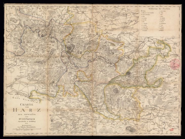 Ein altes Stadtplan von Harz, Deutschland, mit einem schwarzen Hintergrund, der Städte, Ortschaften und die umliegende Landschaft zeigt, mit informativen Text.