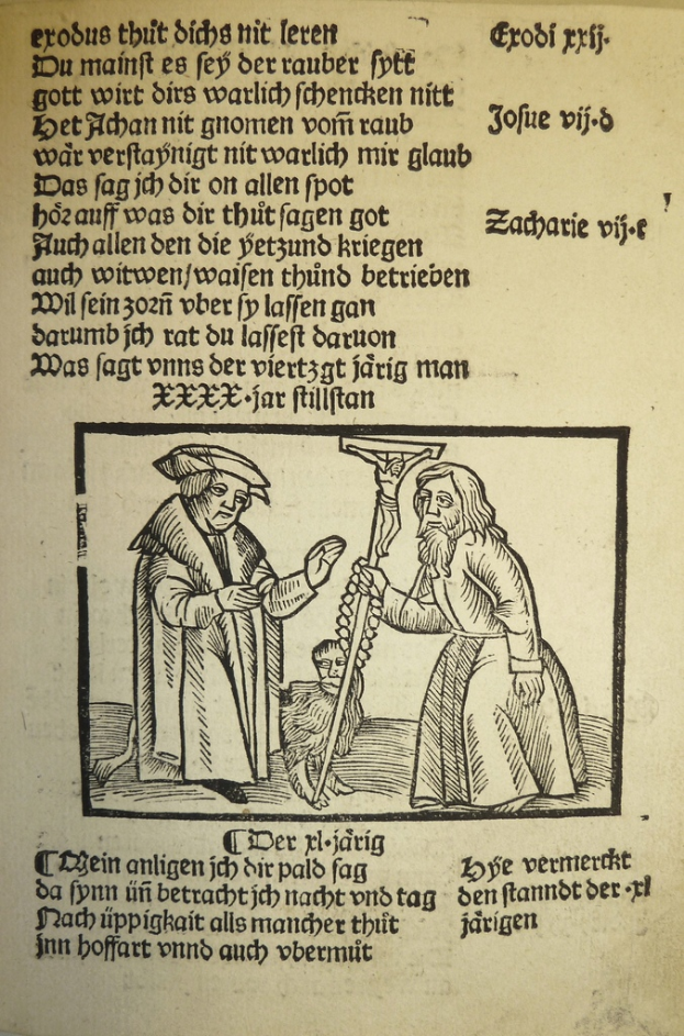 Eine gedruckte Seite in einer fremden Sprache mit zwei Männern im Hintergrund, möglicherweise aus einem Lehrbuch.