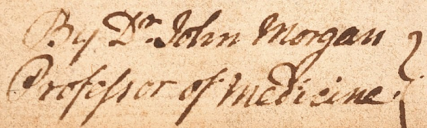 Nahaufnahme einer Rezeptkarte mit handgeschriebener schwarzer Schrift auf einem Blatt Papier.